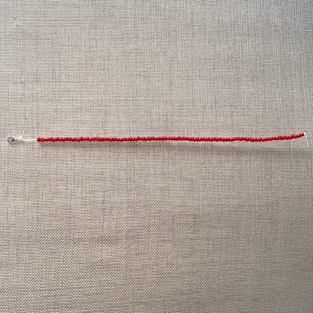 All red choker, adjustable, and very bright!